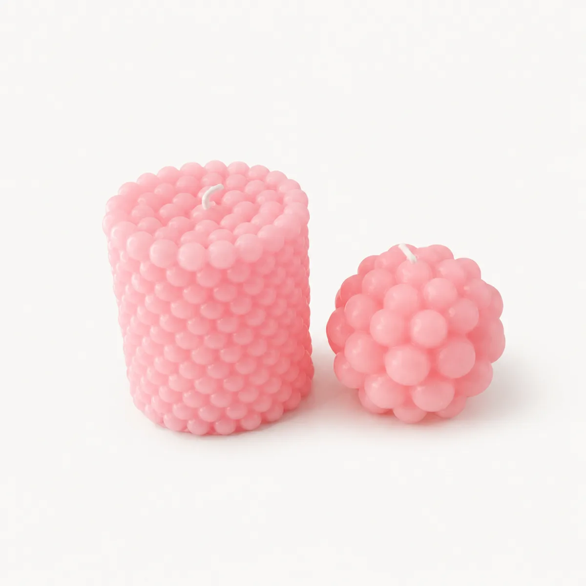 Duo de bougies perlées roses, un pilier et une boule à bulles
