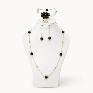 Parure noir et or : sautoir perlé, bracelet, boucles d'oreilles et bague