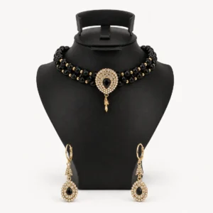 Parure ras-de-cou noir et or avec médaillon rosace en strass et boucles pendantes
