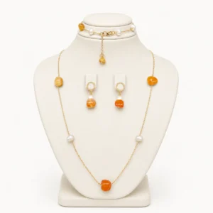 Parure collier long, bracelet et boucles en pierres orange et perles nacrées